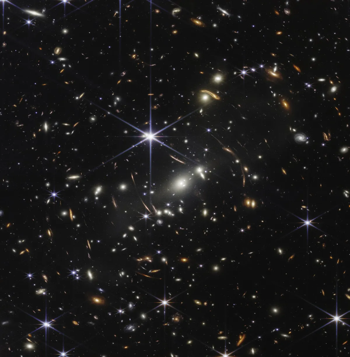 Rappresentazione artistica di una galassia primordiale massiccia osservata dal telescopio spaziale James Webb